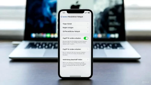 Das iPhone-Menü zeigt die aktivierte Option für eine dauerhafte Hotspot-Verbindung in Deutsch.